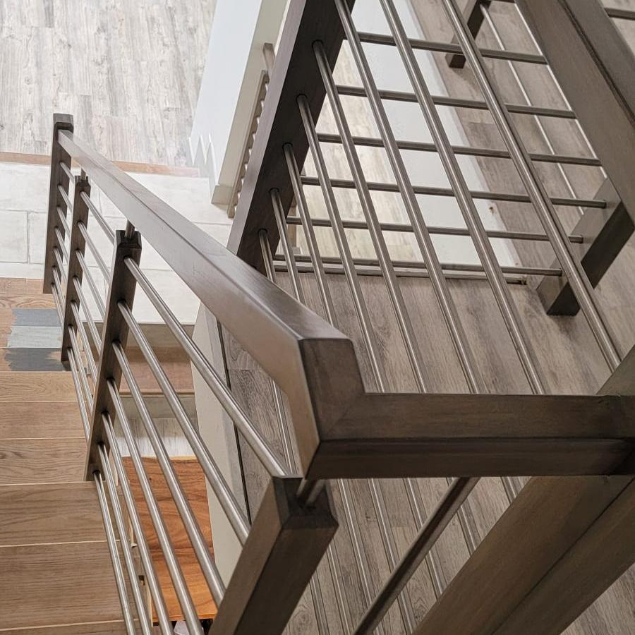 Two-story staircase remodel with updated railing
