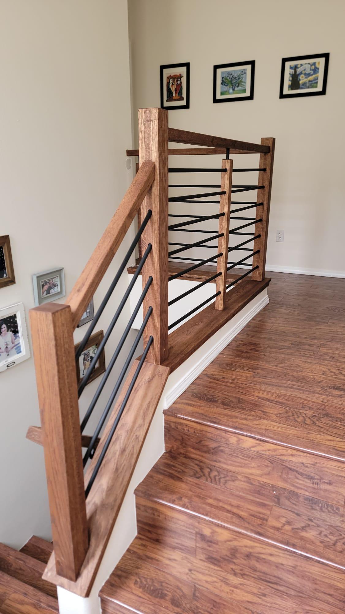 Completed staircase renovation with hardwood and iron