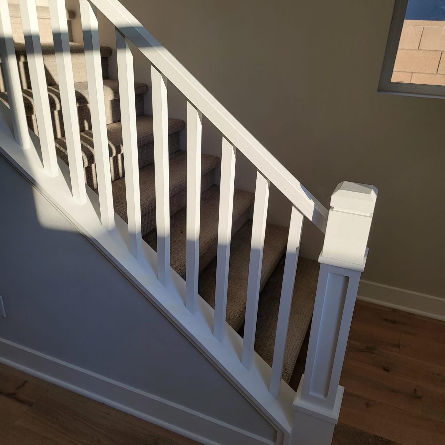 Wainscoting and trim detail along a remodeled stairway